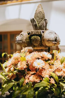 a statue of a rabbit on top of flowers at Anden Inca Hotel in Cusco