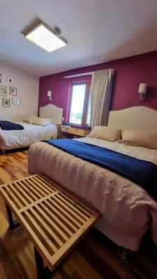 a bedroom with two beds and a window at Anden Inca Hotel in Cusco