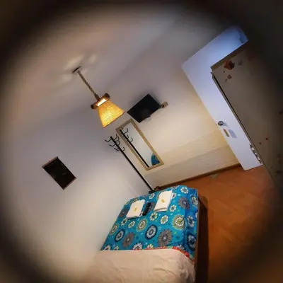 an overhead view of a bedroom with a bed and a lamp at Hostal Brisa Marina in Paracas