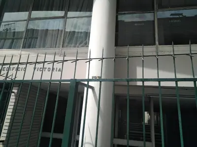 a building with a sign on the side of it at Main Square in Lima