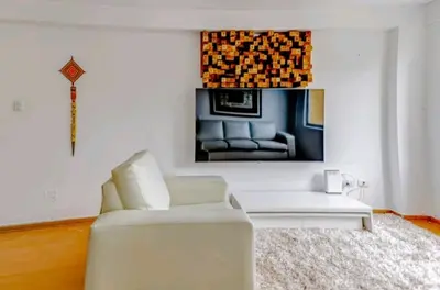 a living room with a couch and a table at Green House in Lima