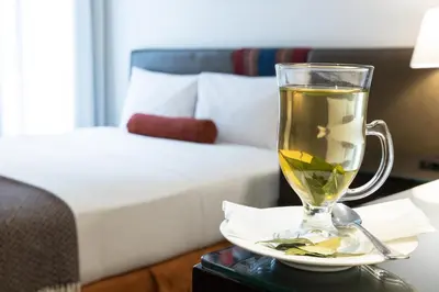 a cup of tea on a table in a hotel room at LP Los Portales Hotel Cusco in Cusco