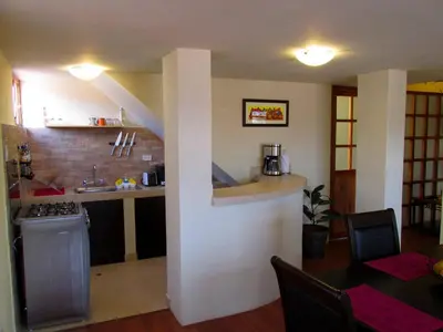 a kitchen with a sink and a counter in a room at Best View apartment downtown Cusco in Cusco