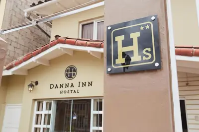 a sign on the side of a building at Hostal Danna Inn in Cusco