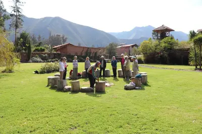 a group of people standing around in a yard at Hotel Villa Urubamba in Urubamba