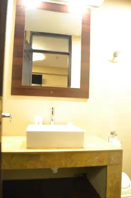 a bathroom with a white sink and a mirror at Hotel Royal Qosqo in Cusco