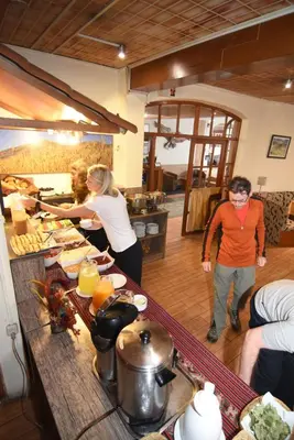 a group of people preparing food in a kitchen at Hotel Prisma Cusco in Cusco