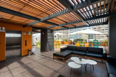 a living room with a couch and a table at Libre Hotel, BW Signature Collection by Best Western in Lima