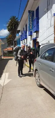 a group of people standing in front of a building at Casona Mollepata in Mollepata