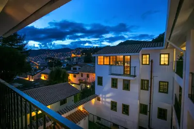 a view from the balcony of a house at night at Atoq San Blas Hotel in Cusco