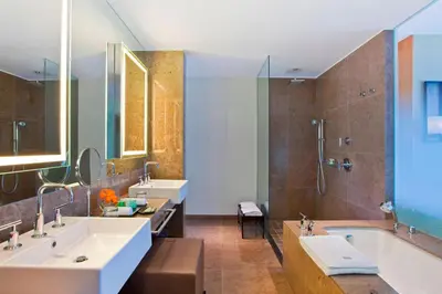 a bathroom with two sinks and a bath tub at The Westin Lima Hotel & Convention Center in Lima