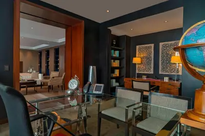 a living room with a glass table and chairs at The Westin Lima Hotel & Convention Center in Lima