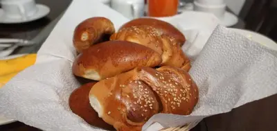 a pile of buns sitting on top of a basket at Machupicchu Guest House in Machu Picchu