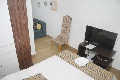 a living room with a television and a chair at Barranco Wasi in Lima