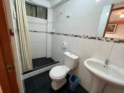 a bathroom with a toilet and a sink at Hostal Apu Qhawarina in Ollantaytambo