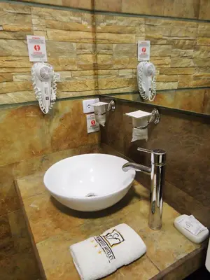 a bathroom with a white sink and a mirror at Hotel San Francisco Plaza in Cusco