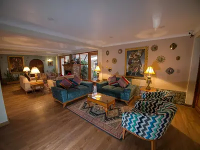 a large living room with couches and a table at Sol Ollantay Boutique Hotel in Ollantaytambo
