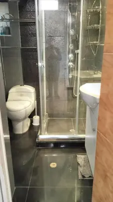a bathroom with a shower with a toilet and a sink at Casa Salkantay Cusco in Cusco