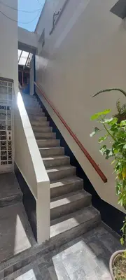 a staircase leading up to a building at Habitación con dos camas, baño privado, terraza y cocina compartida en Miraflores in Lima