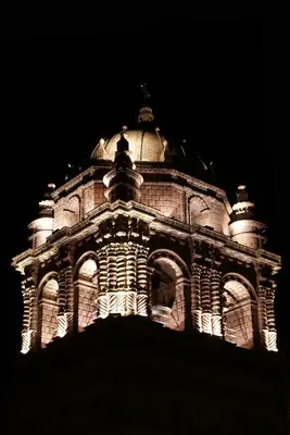 a building lit up at night with at Unaytambo Boutique Hotel Cusco in Cusco
