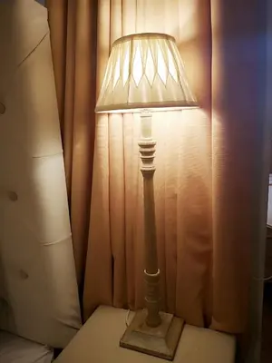 a lamp sitting on a table next to a curtain at Cities of the World - Apartments Cusco in Cusco
