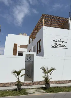 a white building with a sign on it at Betania in Paracas