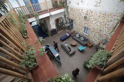an overhead view of a living room with a man at Posada Villa Mayor in Cusco