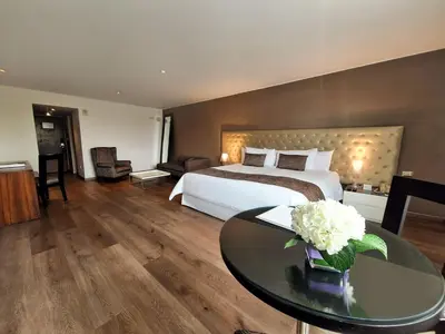 a hotel room with a bed and a table at NM Lima Hotel in Lima