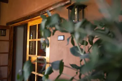 a room with a window and a plant at Las Casitas del Arco Iris in Urubamba