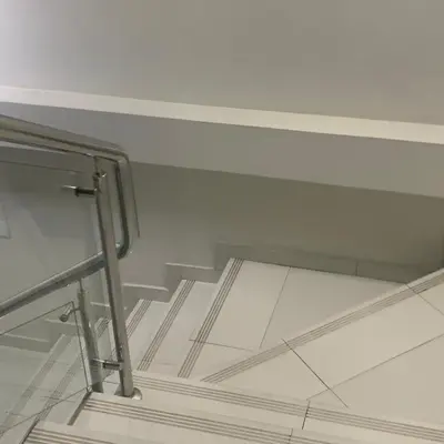 a glass shelf in a room with a stair case at A-Hope Suite Hotel in Huancayo