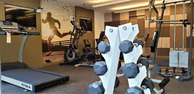 a gym with a bunch of equipment in a room at GL Apts, rent Upper Pardo Miraflores - Suite 1 Hab in Lima