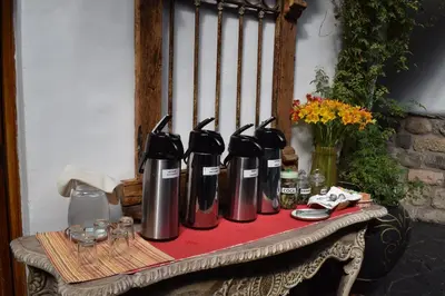 a group of four bottles sitting on a table at Huascaran Casa Boutique San Blas in Cusco
