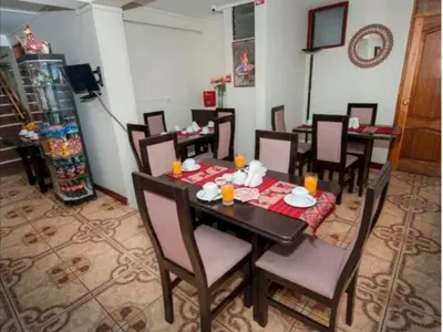 a dining room with a table and chairs at Hotel Luna de Oro Cusco in Cusco