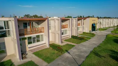 an aerial view of a row of apartment buildings at El Paraíso Eco Resort in Pisco
