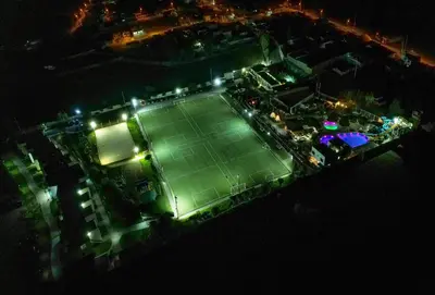 an overhead view of a tennis court at night at El Paraíso Eco Resort in Pisco
