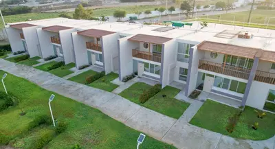 an overhead view of a large white building at El Paraíso Eco Resort in Pisco