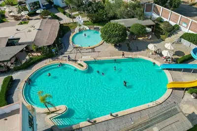 an overhead view of a swimming pool at a resort at El Paraíso Eco Resort in Pisco