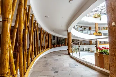 a hallway with bamboo columns in a building at Hacienda del Valle Sagrado in Urubamba