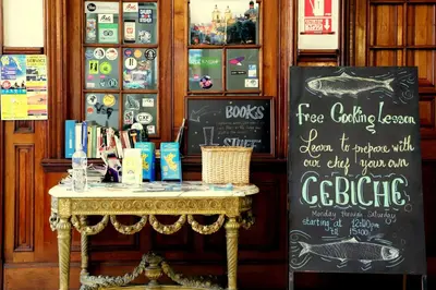 a table in a store with a sign on it at 1900 Backpacker's Hostel in Lima