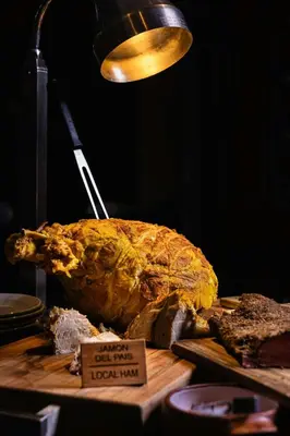 a large turkey sitting on a table with a light at JW Marriott El Convento Cusco in Cusco