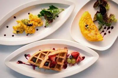 a group of plates of food on a table at Cooper Hotel Boutique in Cusco