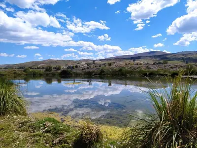 a view of a river with mountains in the background at Alojamiento Casa Yanantin de Maravilca in Concepción