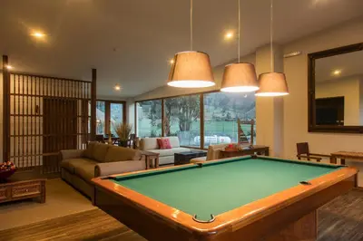 a living room with a pool table at Del Pilar Ollantaytambo in Ollantaytambo
