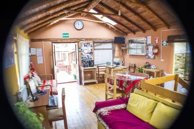 a living room with a couch and a table at Samay Wasi Hostel in Cusco