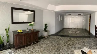 a large room with a mirror and a hallway at MLA apartments - 28 de Julio in Lima