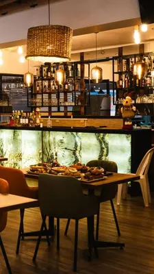 a restaurant with a table with plates of food on it at Hotel Turin in Tarma