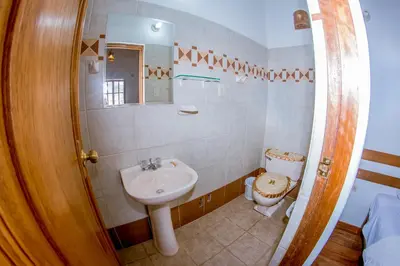 a bathroom with a sink and a toilet at Hostal El Grial in Cusco