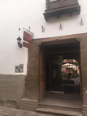an entrance to a building with an open door at Hostal Qorichaska in Cusco