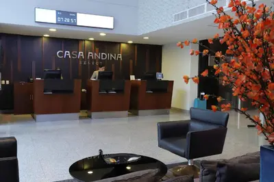 an office with a reception desk and a person in the lobby at Casa Andina Select Miraflores in Lima
