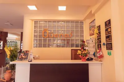 a counter in a store with a sign on the wall at Hotel Las Quenas in Cusco